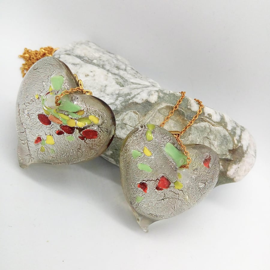 Clear Glass Heart Shaped Pendant with Green Yellow & Red Flecks on a Gold Chain