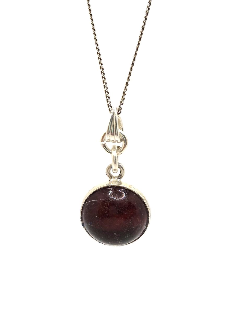Cherry baltic amber gemstone set in a sterling silver mount pendant with chain