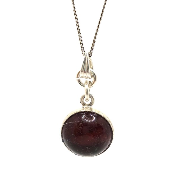 Cherry baltic amber gemstone set in a sterling silver mount pendant with chain