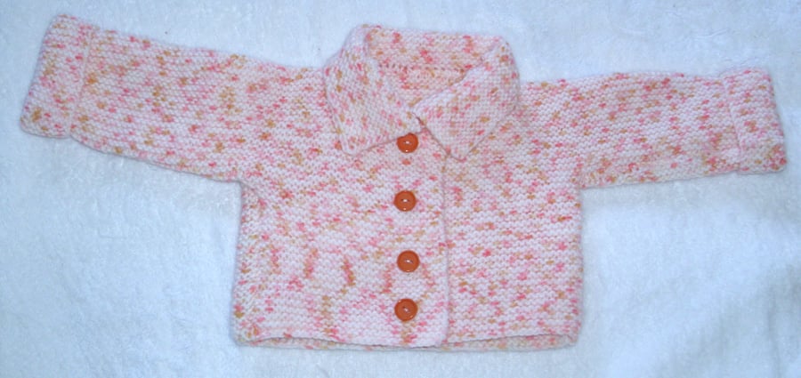 Hand Knitted pale peach and orange coat for baby 0 to 3 months