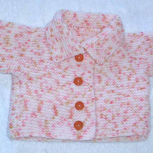 Hand Knitted pale peach and orange coat for baby 0 to 3 months