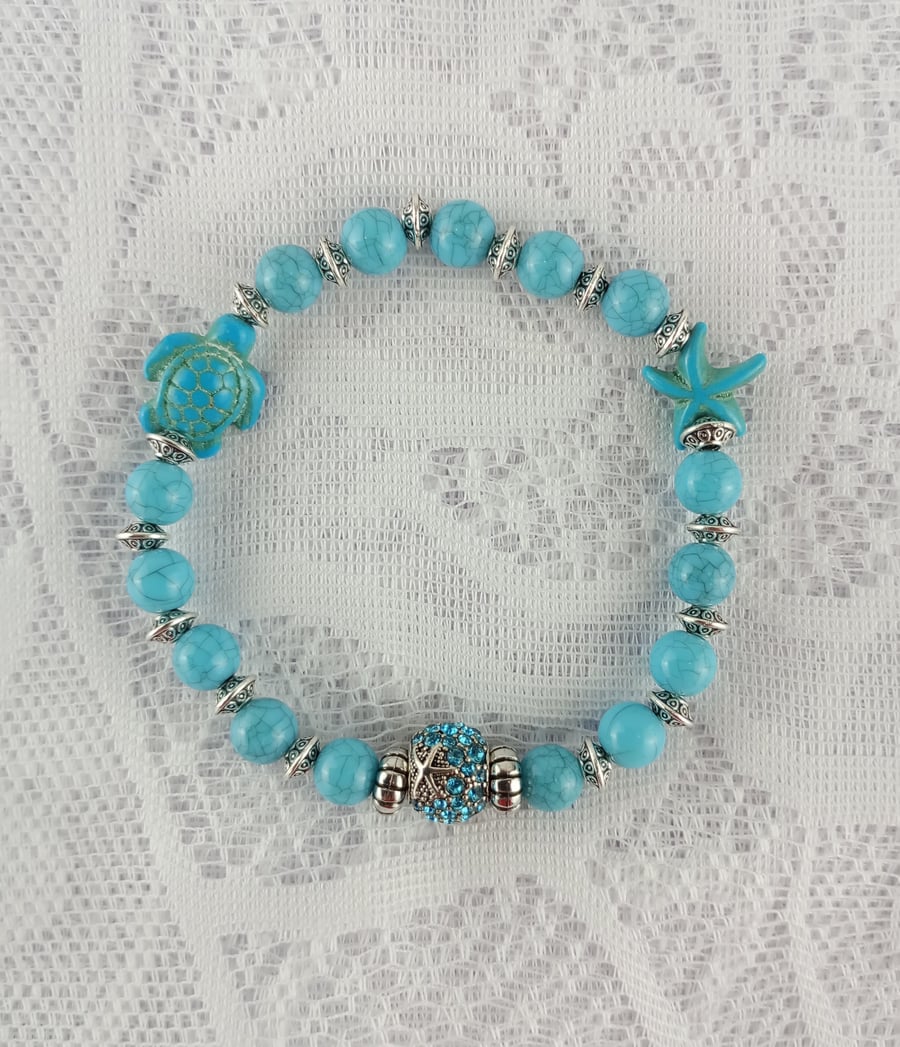 Blue bracelet with artificial turquoise Sea Turtle, Starfish beads, charm bead