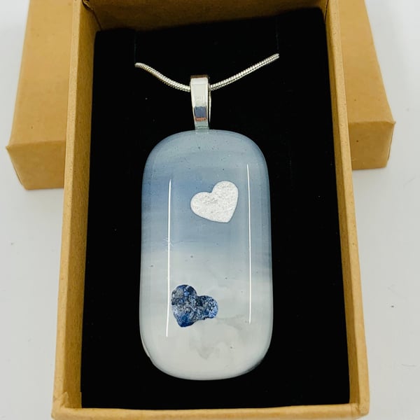 Hand made Fused Glass and enamel painted pendant with heart inclusions.