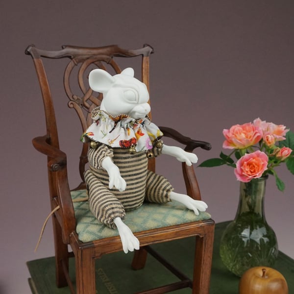 'Clarence', a porcelain and textile mouse doll.
