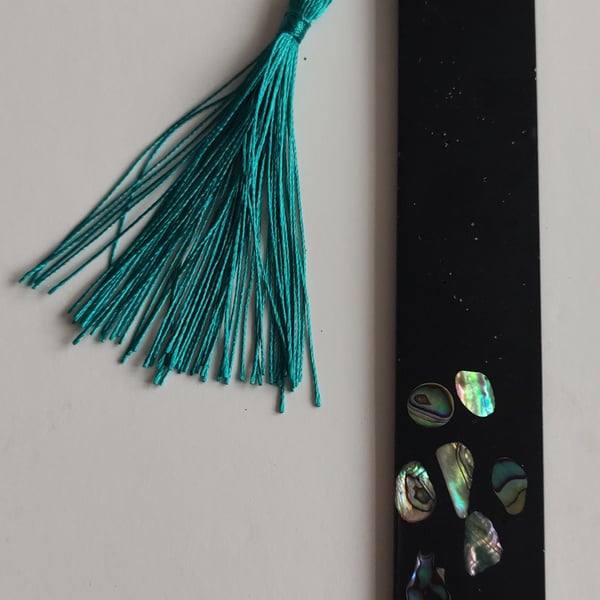 Handmade resin bookmark with responsibly sourced abalone shell.