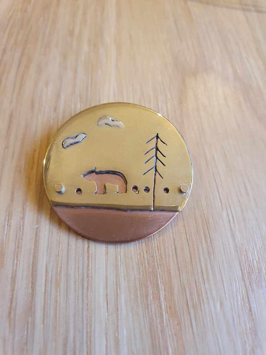 Brass and coper bear in the woods pendant