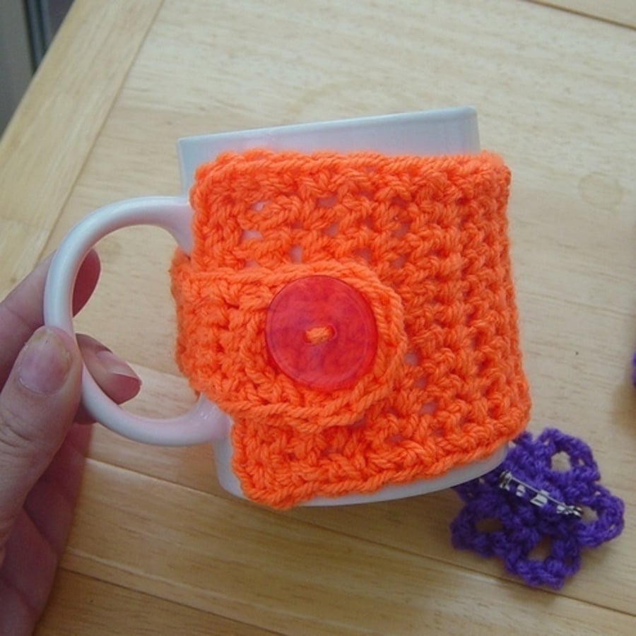 Orange Mug Hug and Contrasting Purple Floral Brooch