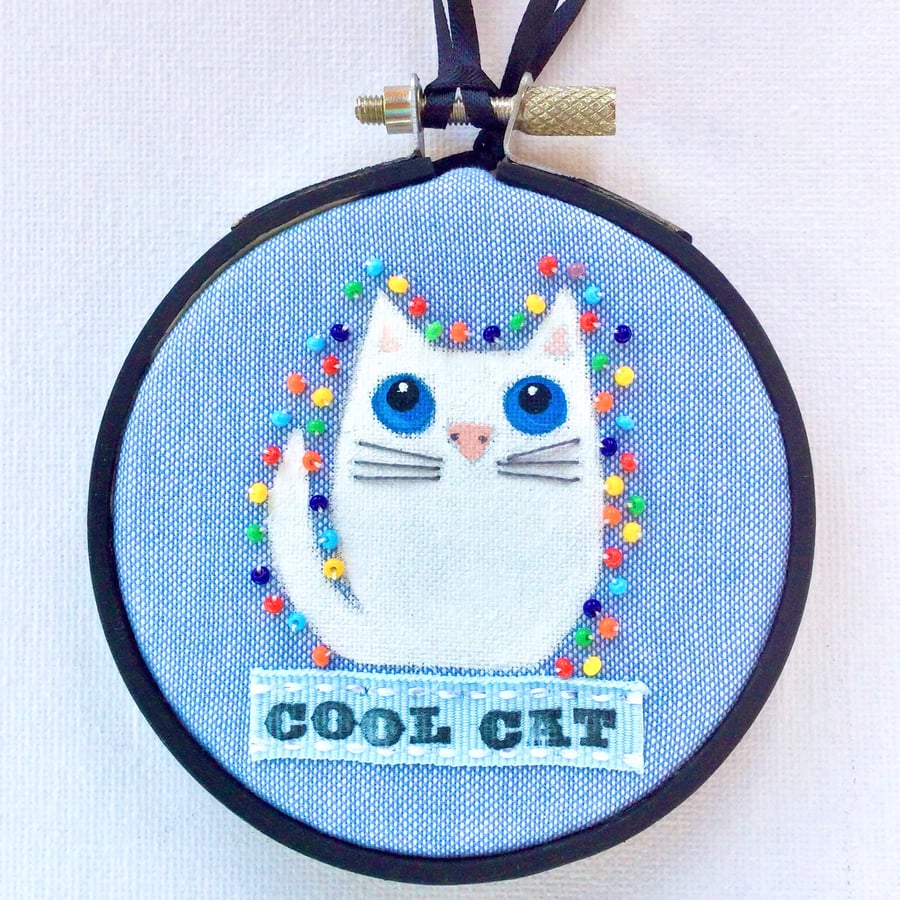 White cat Hoop art.