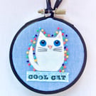 White cat Hoop art.
