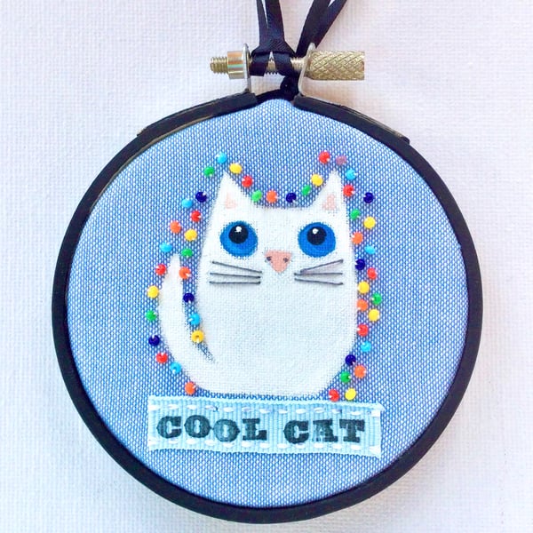 White cat Hoop art.