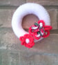 Hand Knitted White Mini Wreath with Red Flowers - Image 1