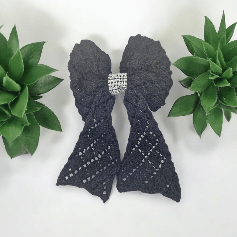 Large black knitted bow