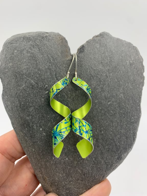 lime green aluminium spiral earrings with cow parsley print