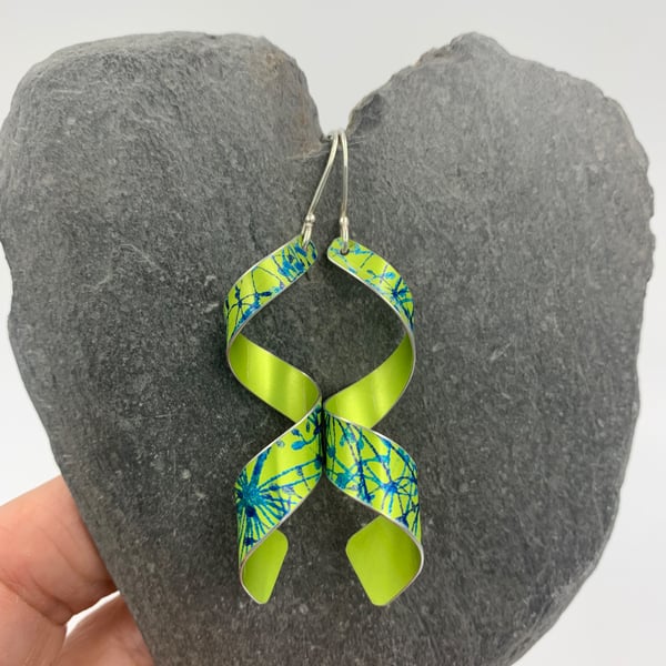 lime green aluminium spiral earrings with cow parsley print