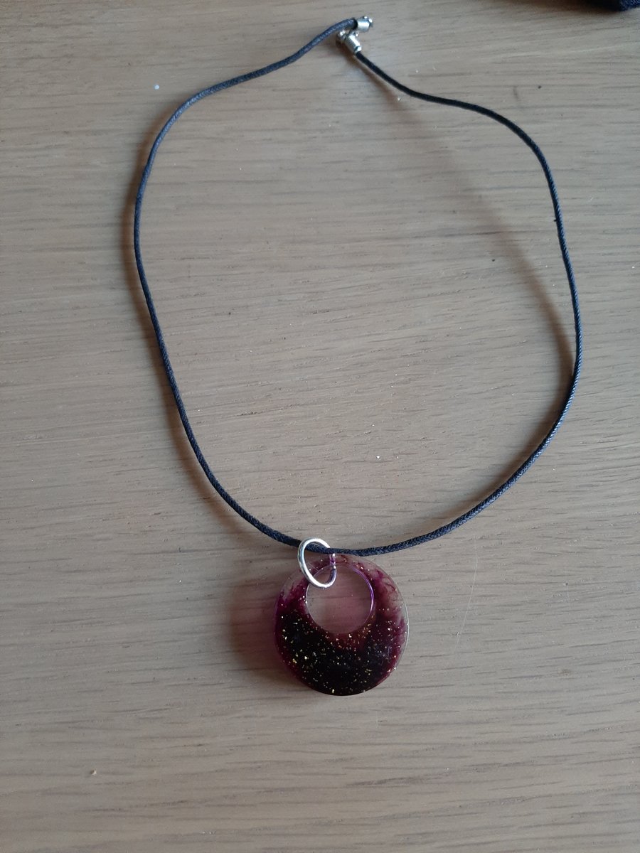 waxed rope with purple and gold pendent 