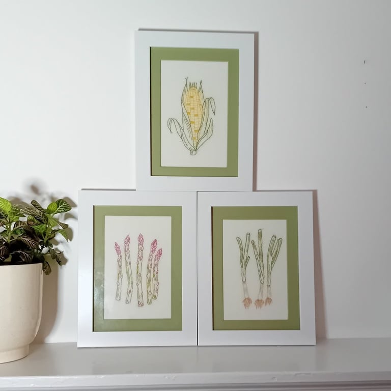 Set of three framed embroidered pictures