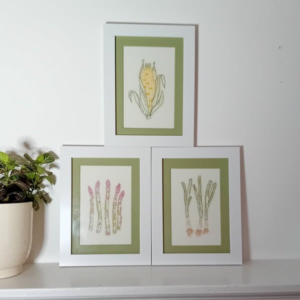 Set of three framed embroidered pictures