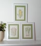 Set of three framed embroidered pictures