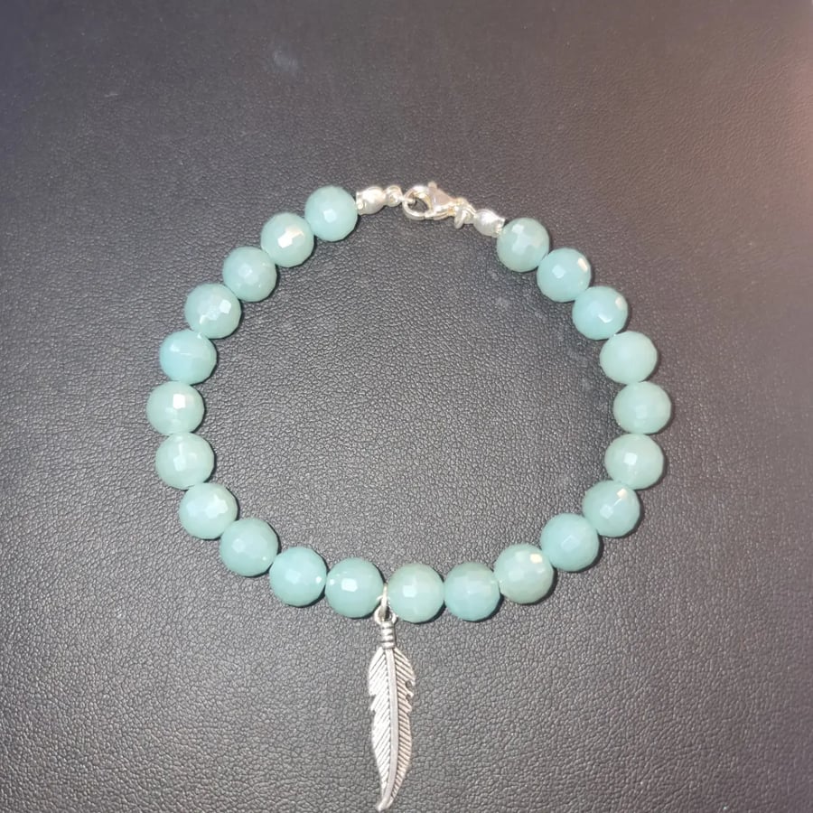 Turquoise faceted bracelet with feather charm