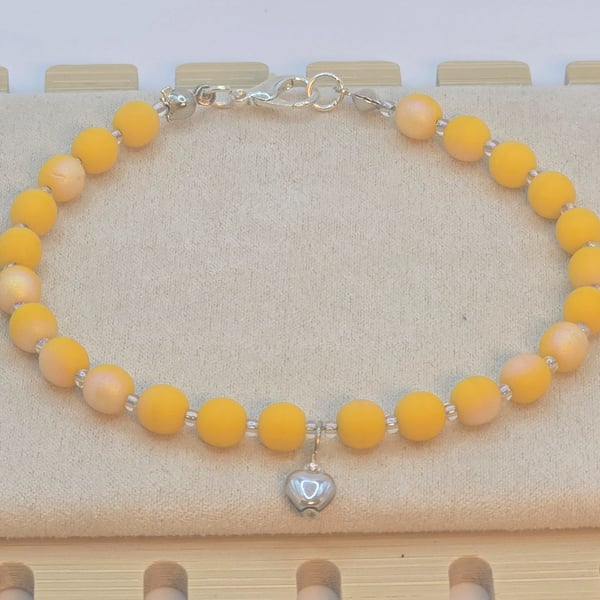Yellow Czech glass bracelet with silver heart charm