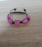 PINK AND BLACK CRACKLE BEAD MACRAME BRACELET. - Image 1