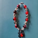 Elasticated red and black gothic spider charm bead bracelet