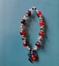 Elasticated red and black gothic spider charm bead bracelet