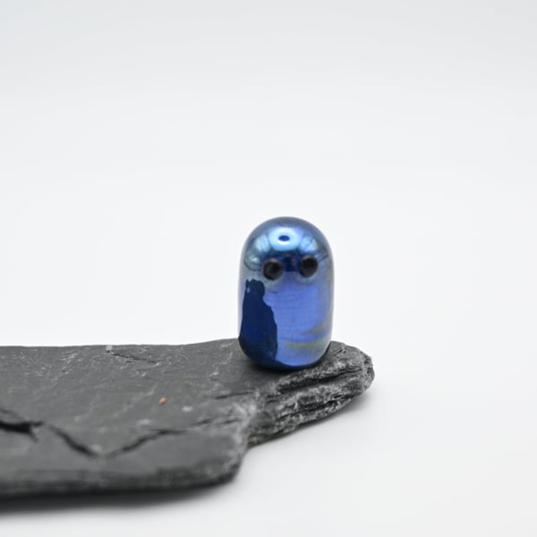small metallic blue glass ghost
