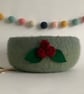 FELTED 'FUSSPOT'  BOWL ,desk tidy . Green ( with red rosebud corsage ) 