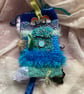 Twiddle mitt multi sensory aid - Image 1