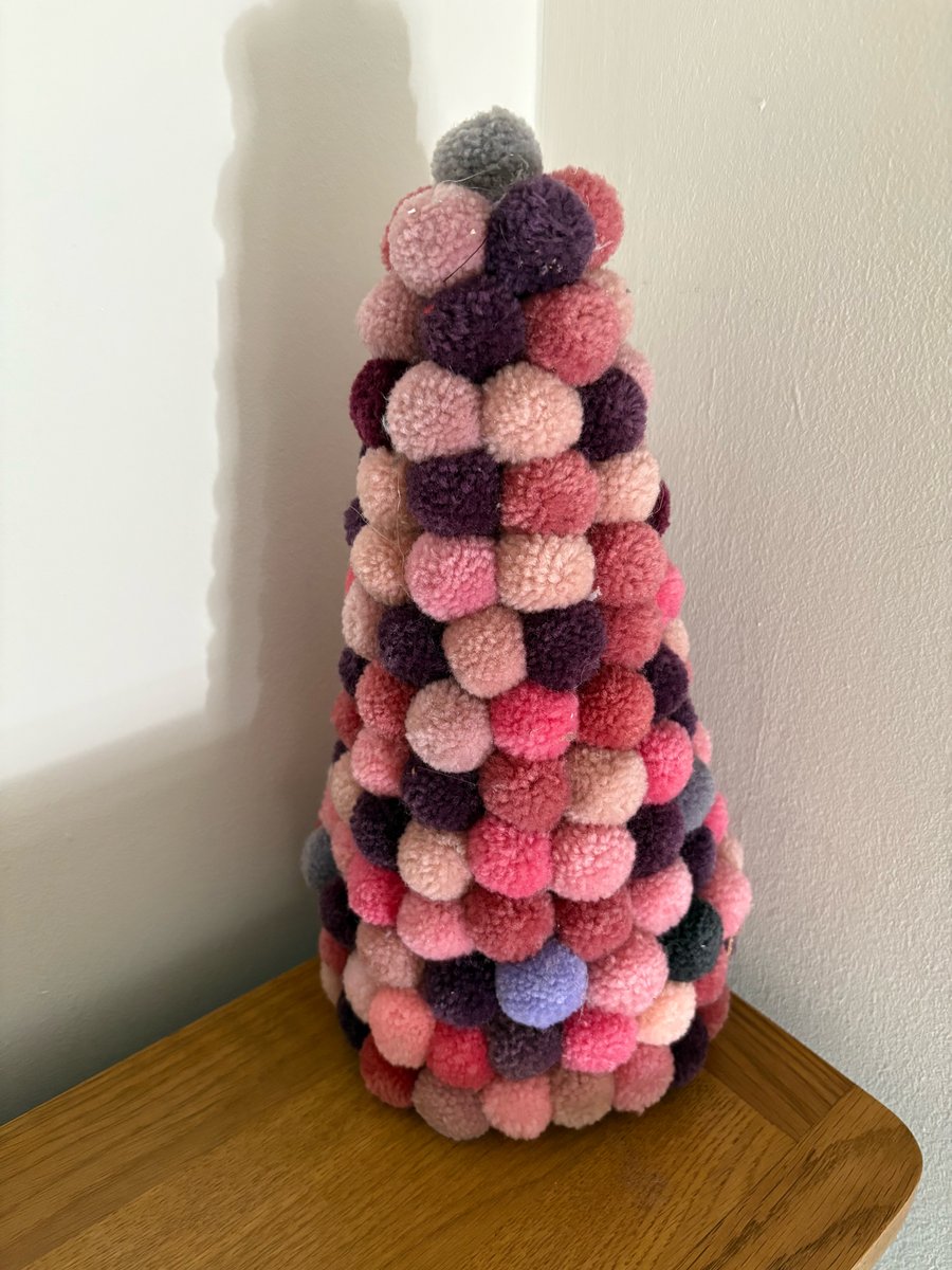 Pom Pom decorated cone. 