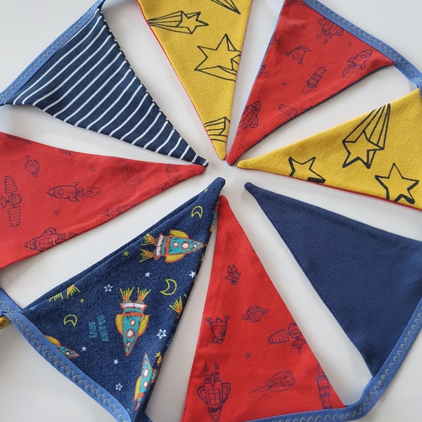 Exciting Rockets and Stars Bunting on Blue Binding