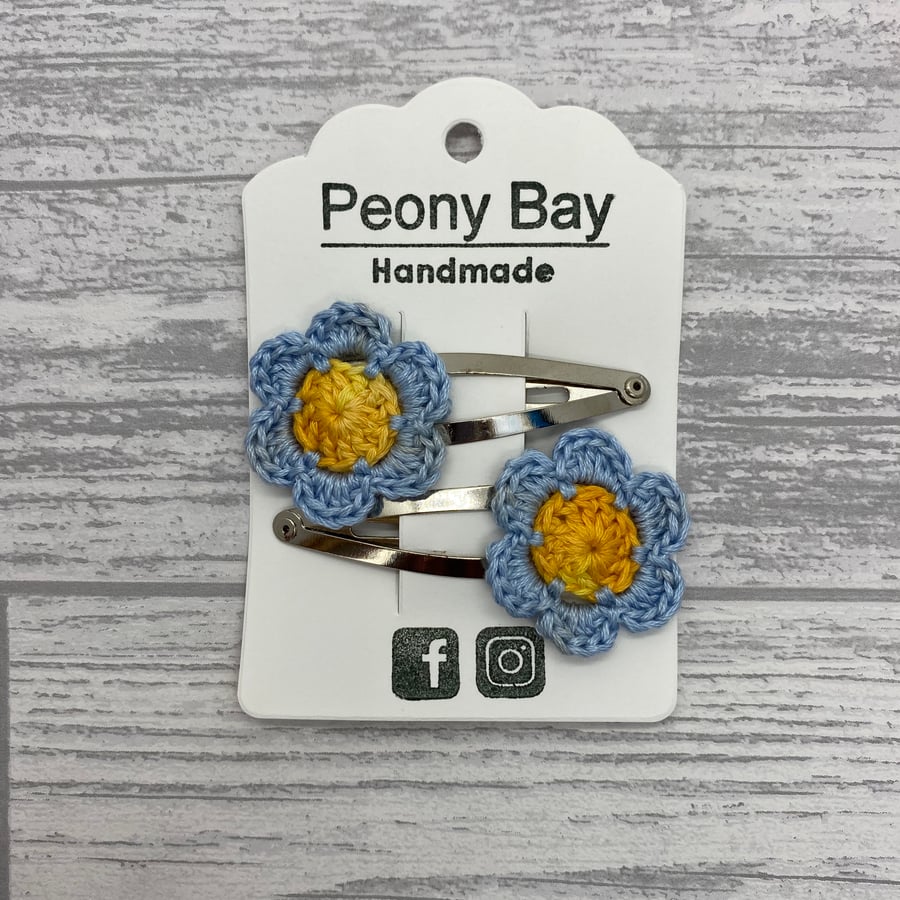 Girl’s hair clips, pair of blue and yellow flower clips 