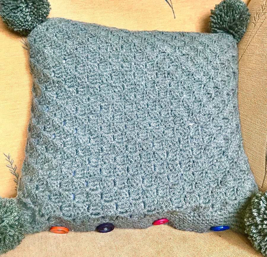 Khaki Pom-Pom Cushion. 