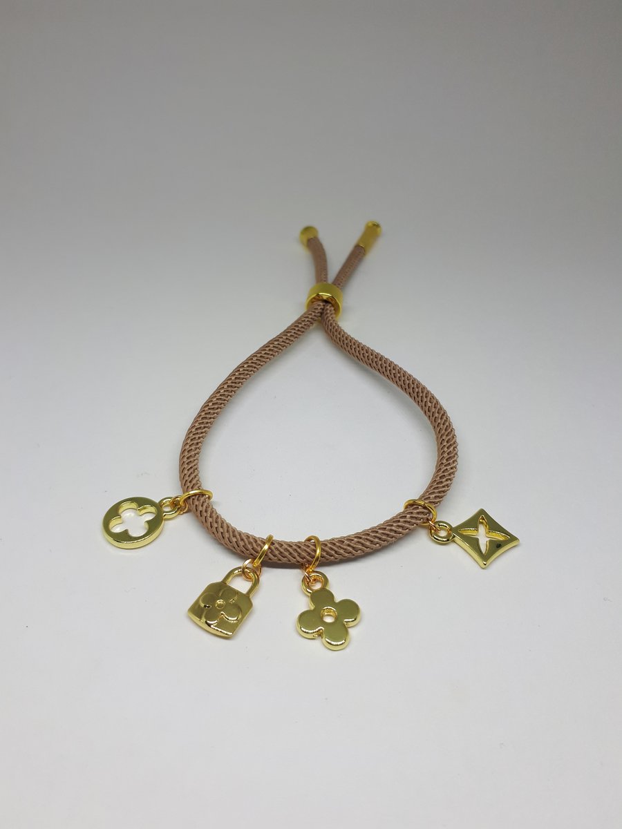 Cotton corn bracelet with gold dangle motif charms, taupe