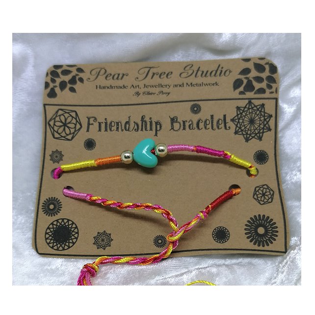 Friendship bracelet with pale blue heart bead.