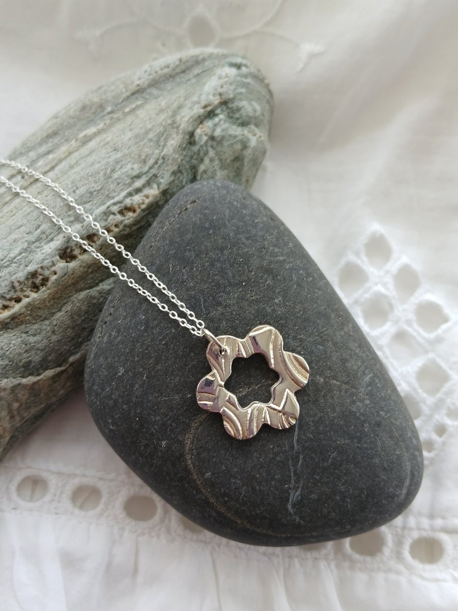 Silver flower pendant