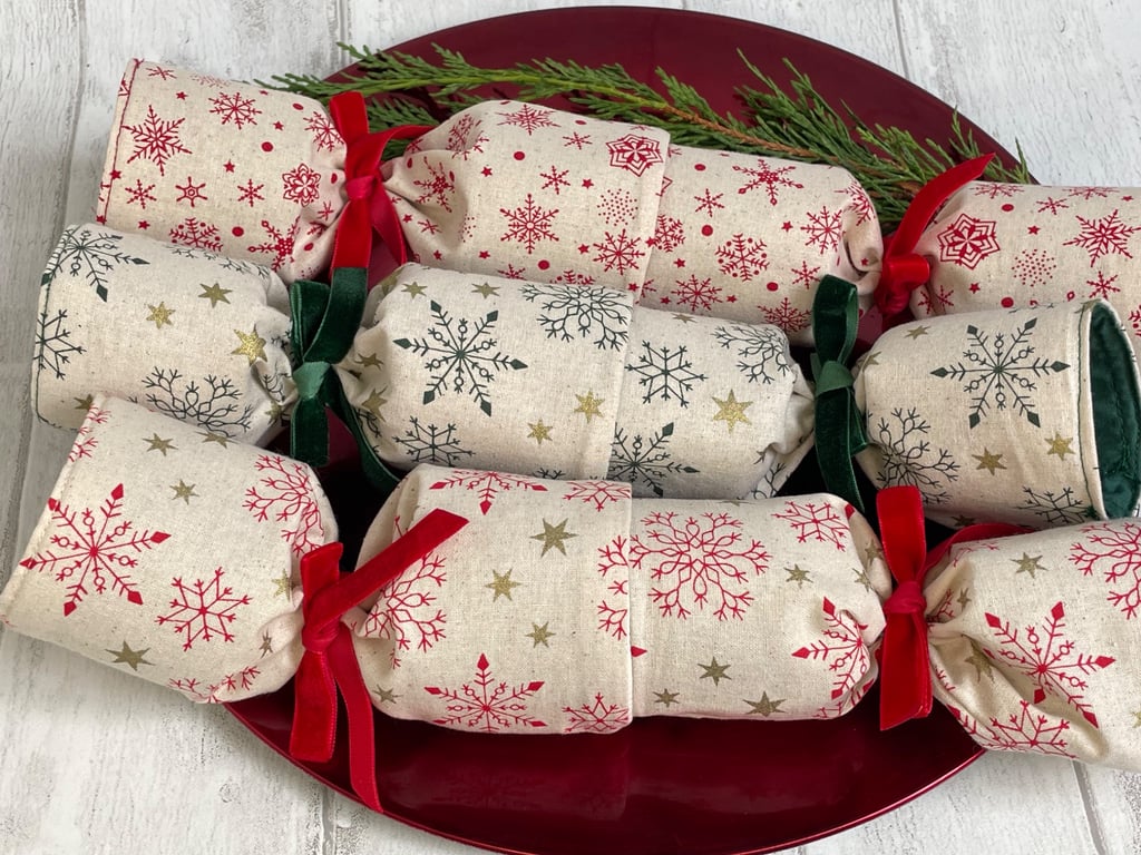 Set of three Christmas crackers. Scandi-style snowflakes with velvet ribbons