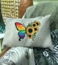 Oblong embroidered cushion, rainbow Butterfly and sunflowers.