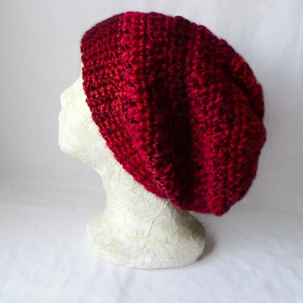 red crocheted slouchie beanie hat with criss cross stitches