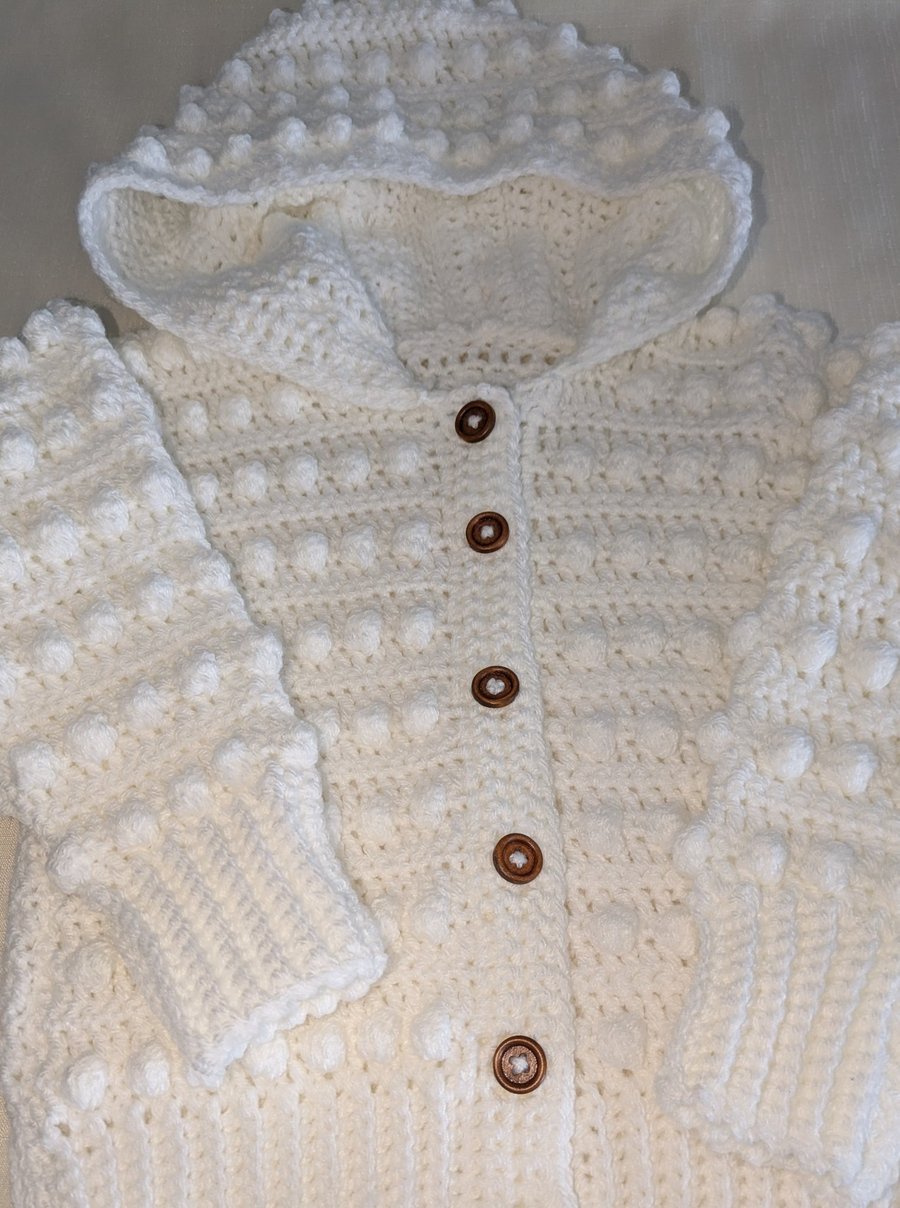 White hooded cardigan handmade for a small girl ages around 2.5 years old 
