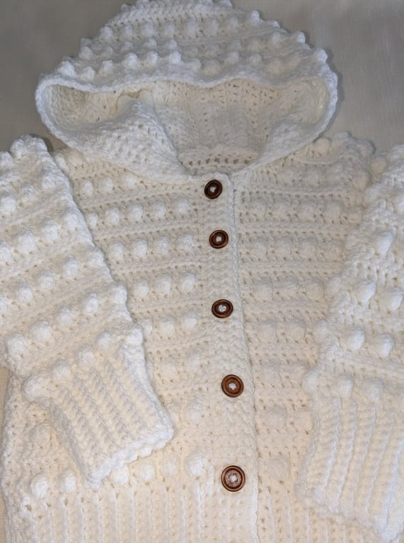 White hooded cardigan handmade for a small girl ages around 2.5 years old 