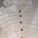White hooded cardigan handmade for a small girl ages around 2.5 years old 
