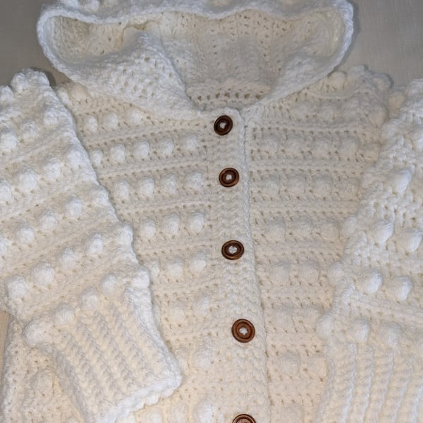 White hooded cardigan handmade for a small girl ages around 2.5 years old 