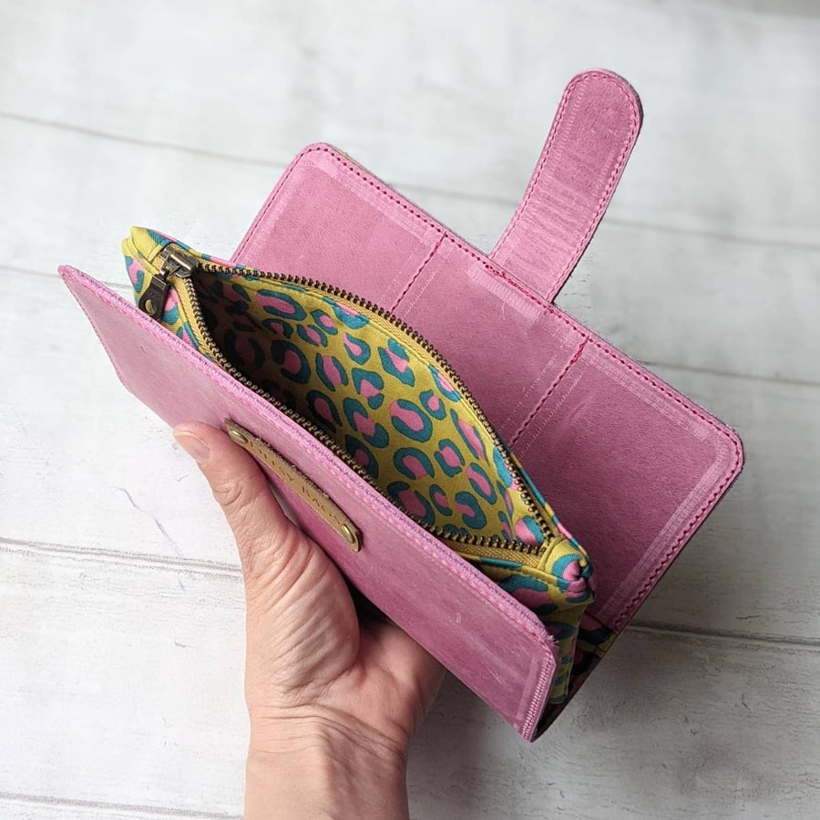 Pink leather wallet, fits a phone, cash and cards