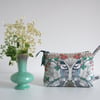 Toiletries or make up bag with an exotic bird print design