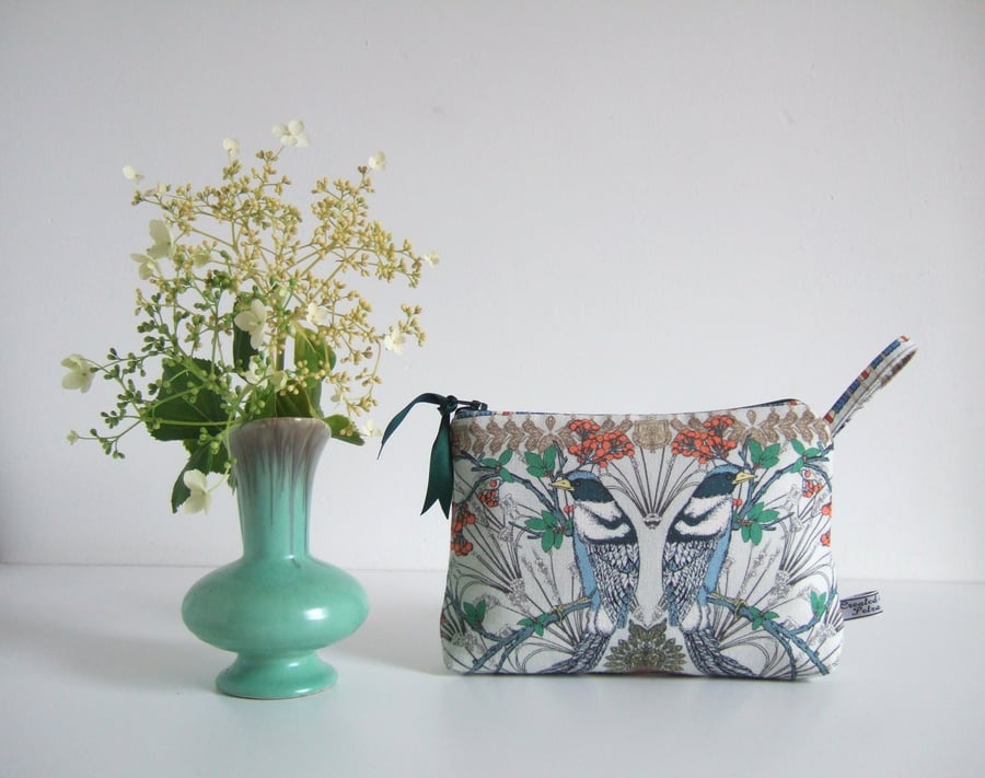 Toiletries or make up bag with an exotic bird print design