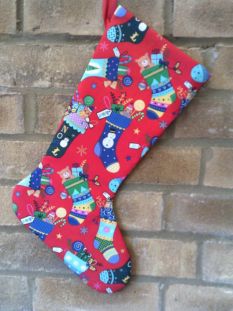 Christmas Stocking with stockings full of Gifts on a red background 
