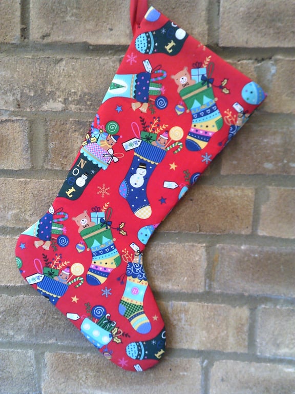 Christmas Stocking with stockings full of Gifts on a red background 