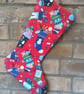 Christmas Stocking with stockings full of Gifts on a red background  - Image 1